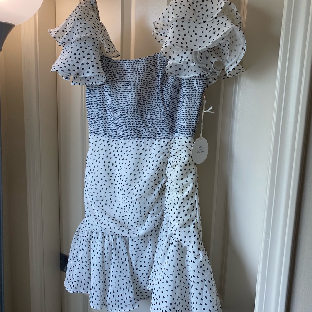 White with navy accented dress.